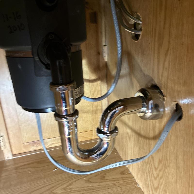 Kitchen sink drain trap and disposal plumbing setup