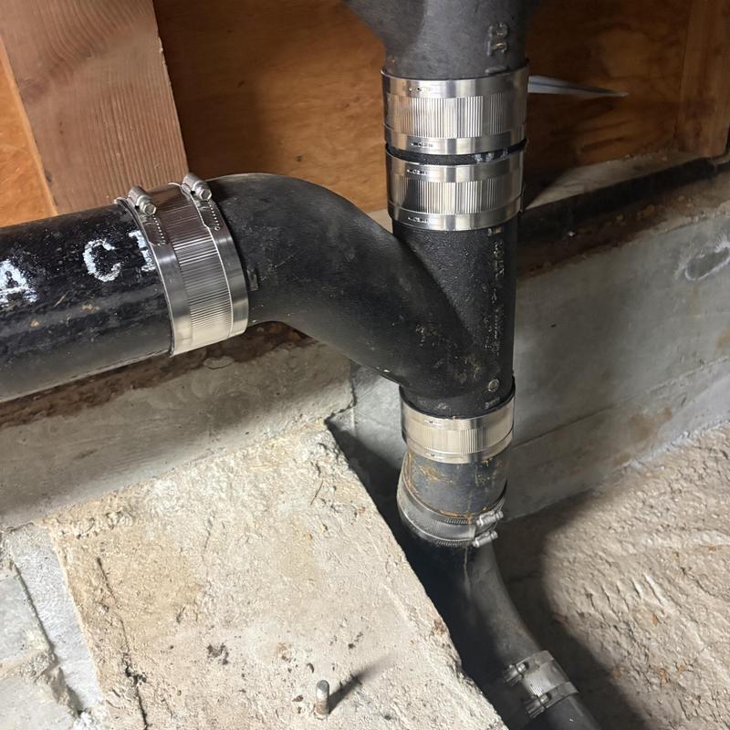 Cast iron sewer line with stainless steel clamps installed