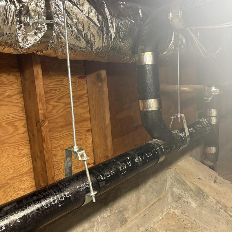 Cast iron sewer line with new hangers installed