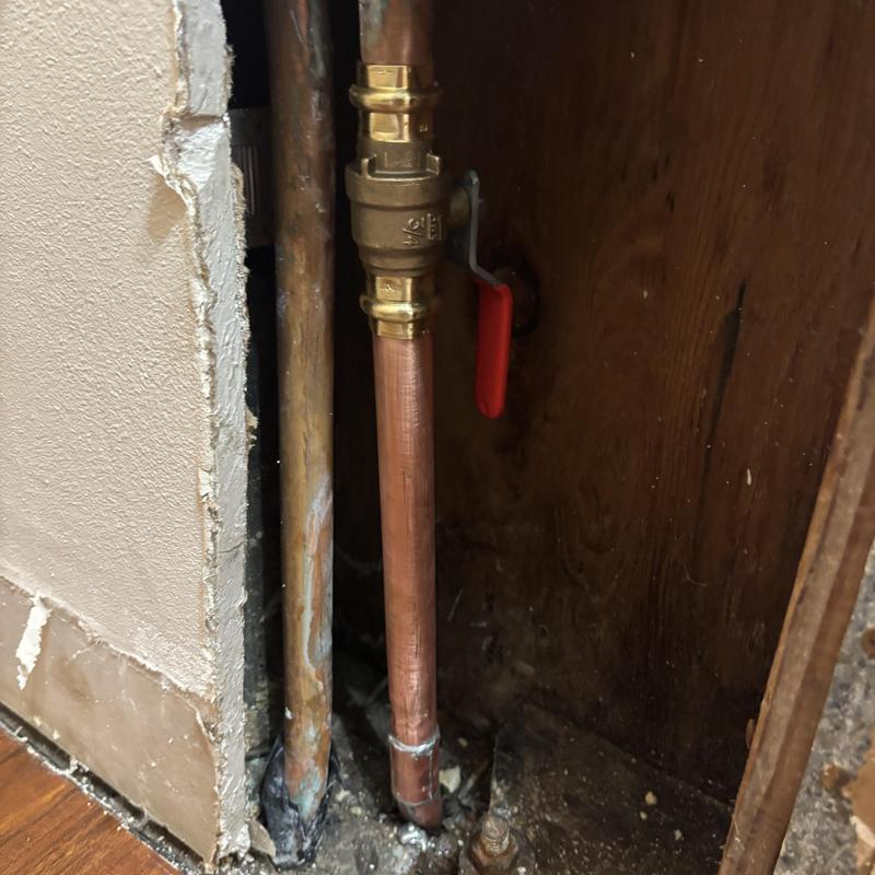 Copper hot water pipe with ball valve repair in wall cavity Copper hot water pipe with ball valve repair in wall cavity