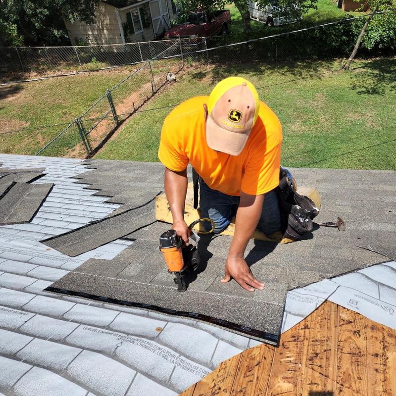 Asphalt shingle roofing installation on residential roof