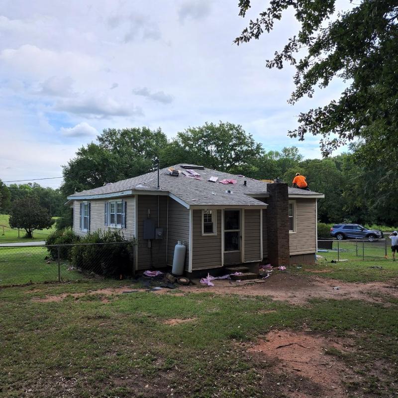 Asphalt shingle roof installation on residential house