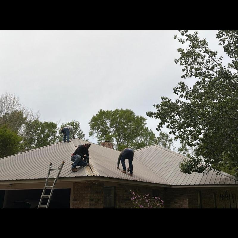 Metal roof panels removal on residential house