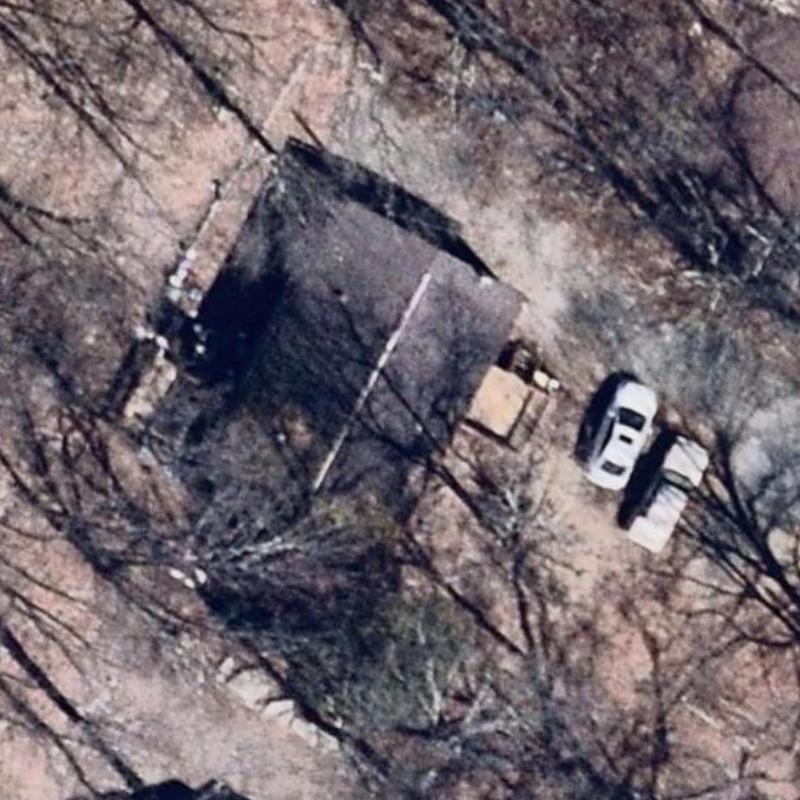 Residential roof inspection with vehicles nearby Residential roof inspection with vehicles nearby