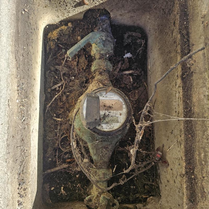 Water meter with partially open ball valve in valve box