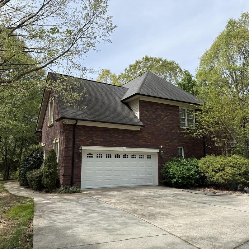 Asphalt shingle roof on two-story brick home Asphalt shingle roof on two-story brick home