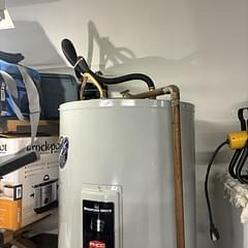Water heater with diagnostic tools in garage storage area