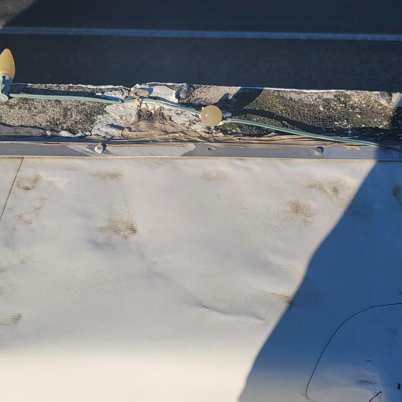 Roof membrane damage and worn flashing sealant
