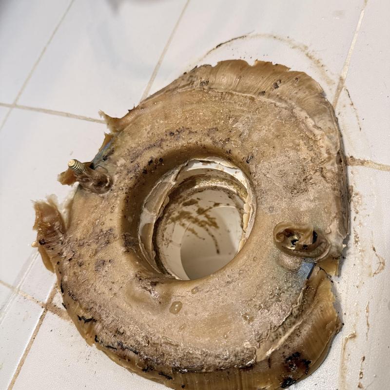 Toilet wax ring seal with damaged flange on tiled floor Toilet wax ring seal with damaged flange on tiled floor