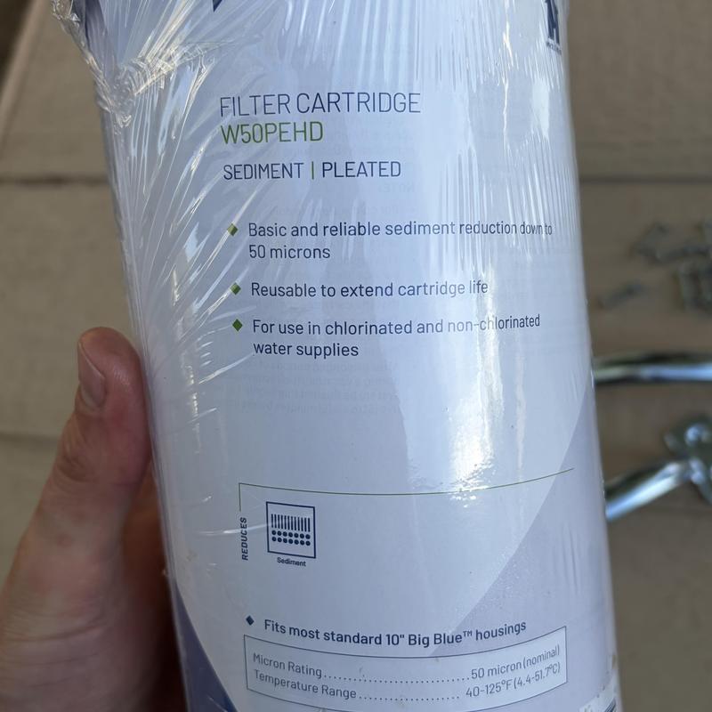 Sediment water filter cartridge in plastic wrap