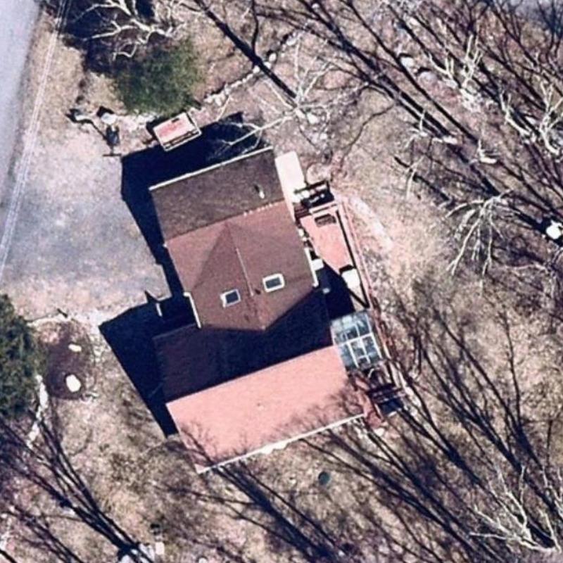 Roof shingles aerial view of residential home and yard Roof shingles aerial view of residential home and yard