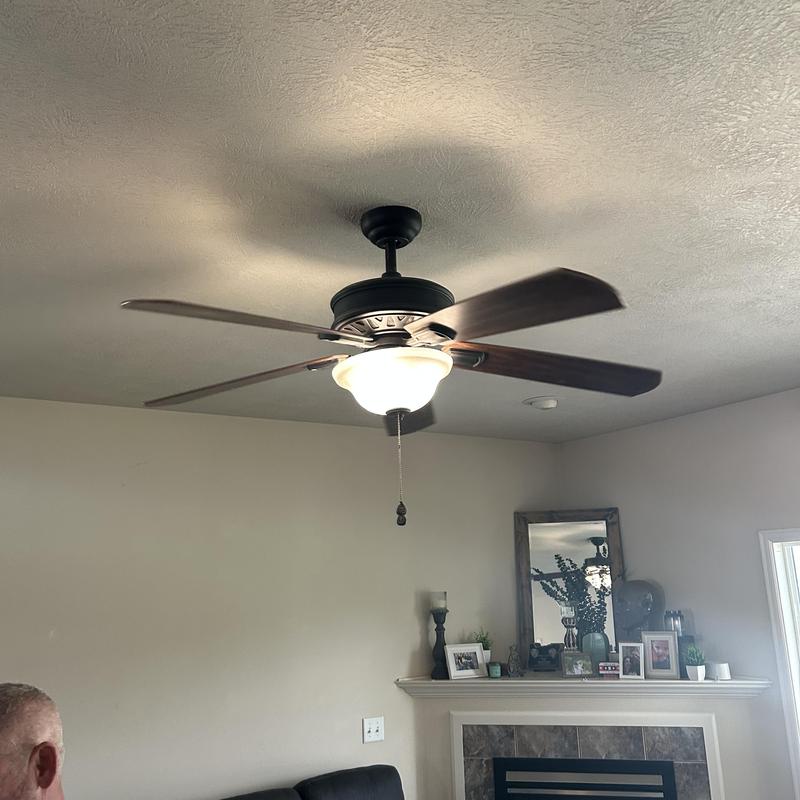 Ceiling fan with light fixture installation in living room Ceiling fan with light fixture installation in living room
