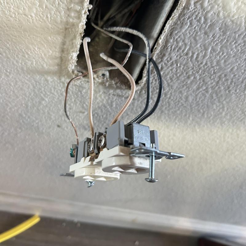 Living room electrical receptacle wiring exposed during repair Living room electrical receptacle wiring exposed during repair