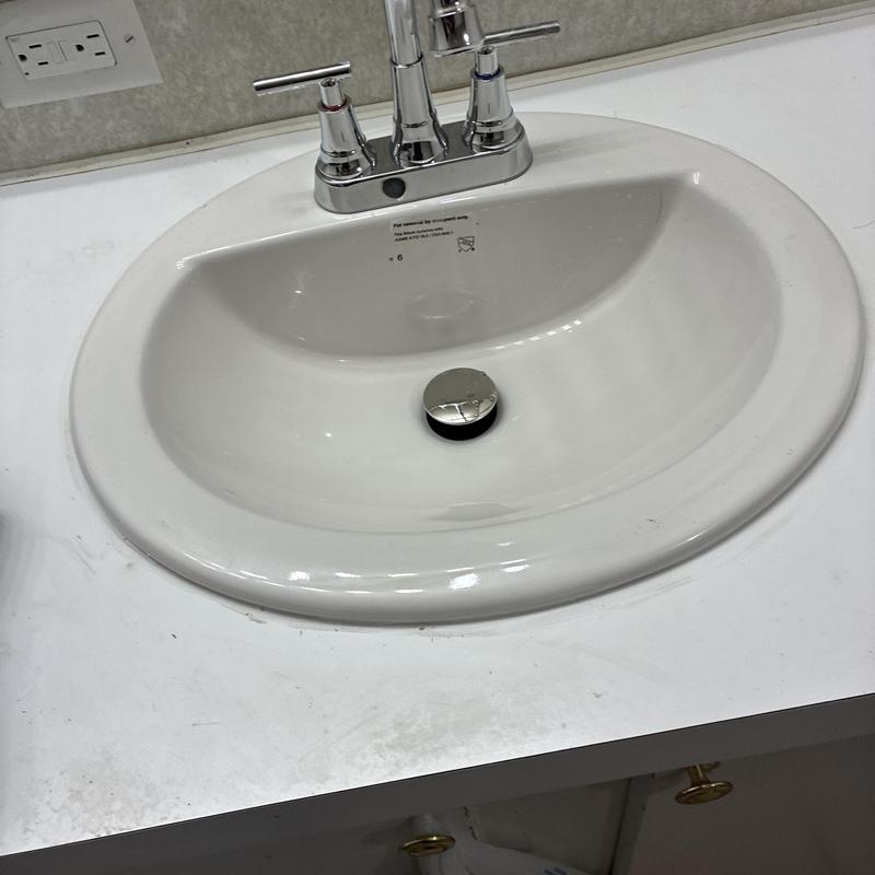 Bathroom sink with faucet and pop-up drain assembly