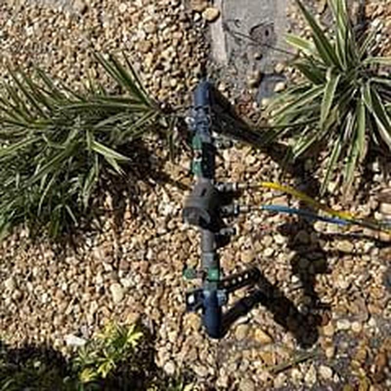 Backflow prevention device with test gauges in gravel bed