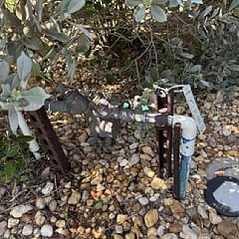 Backflow prevention device with test gauges on gravel