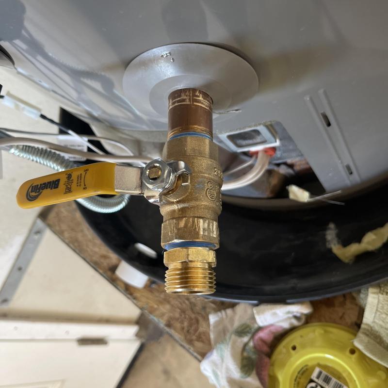 Water heater drain valve with yellow handle installed
