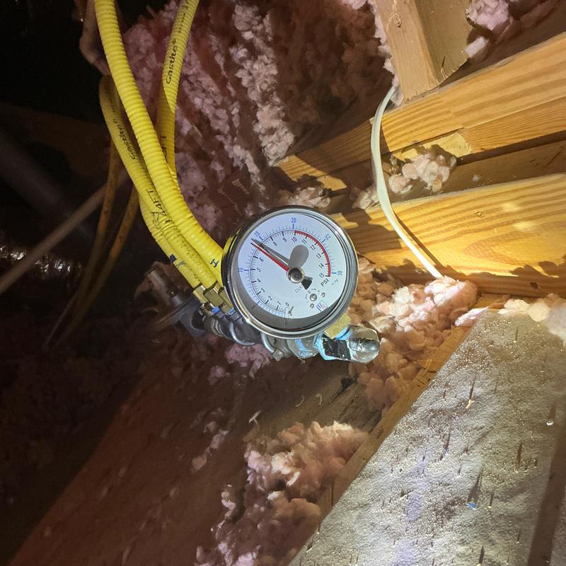 Gas pressure gauge on flexible gas lines in attic
