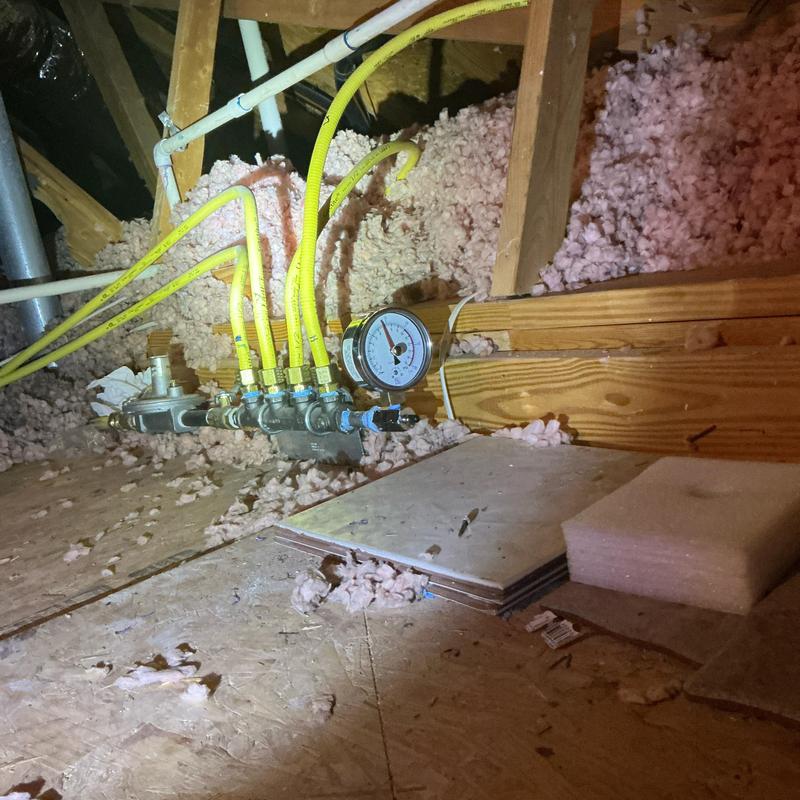 Gas manifold and pressure gauge in attic space