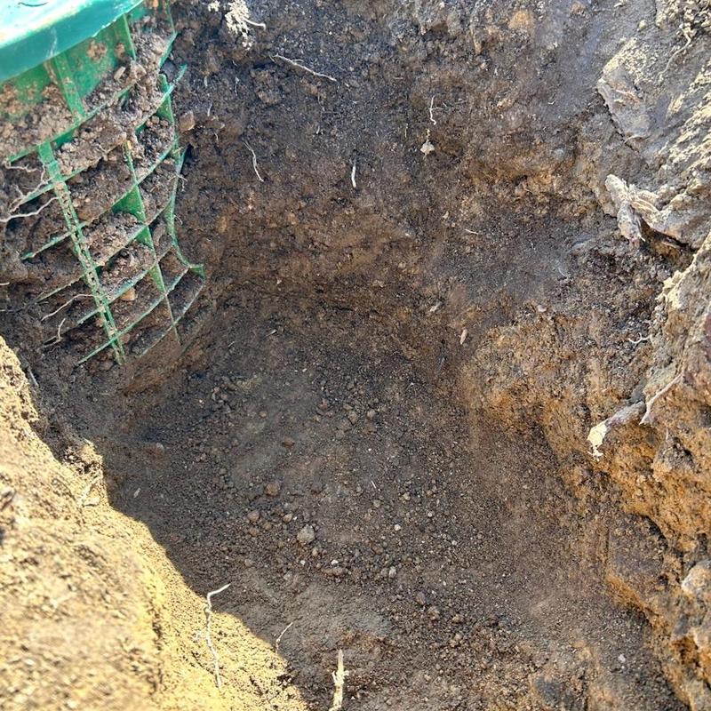 Main line sewer cleanout excavation with green access box Main line sewer cleanout excavation with green access box