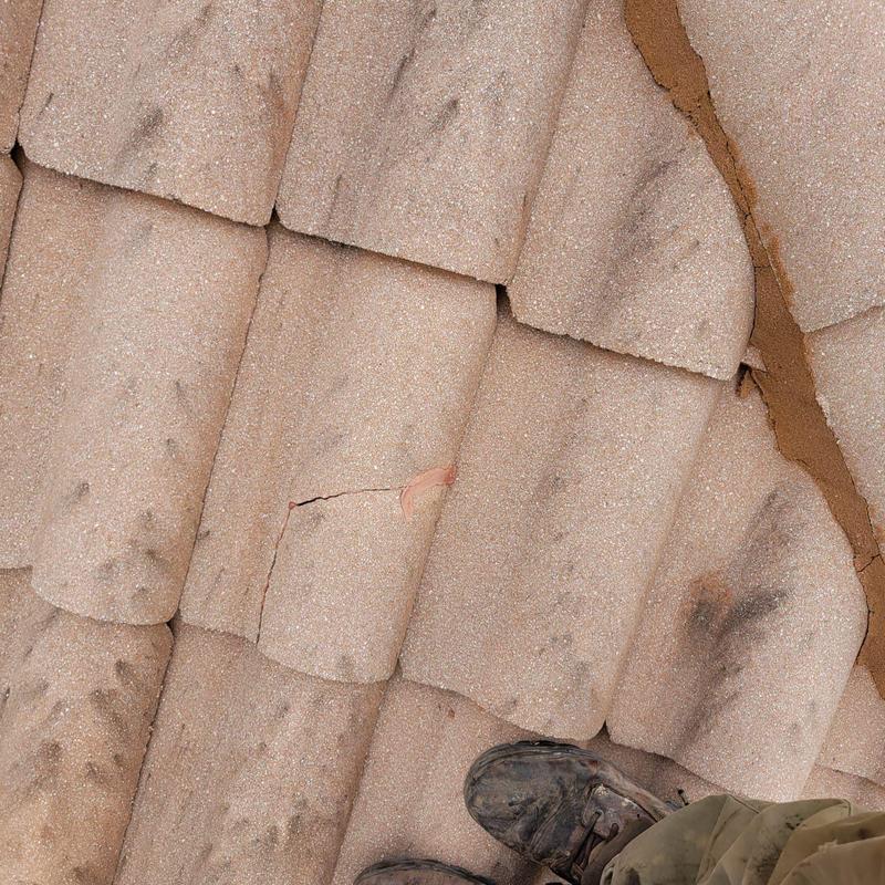 Concrete tile roof with cracked and failing mortar