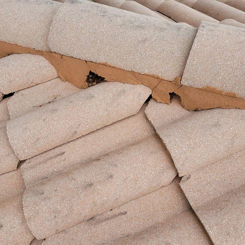 Concrete tile roof with cracked and failing mortar joints