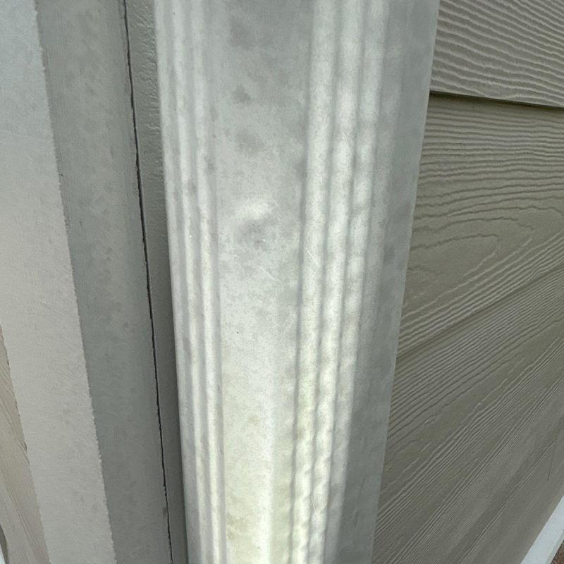 Vinyl siding corner trim with surface dents and marks