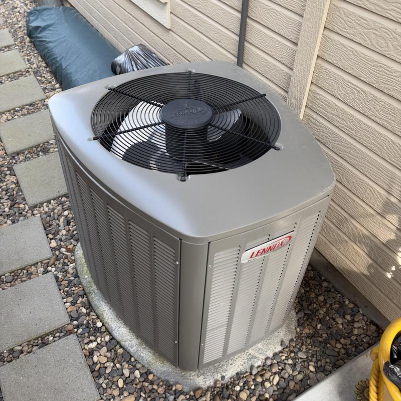 Lennox outdoor air conditioning unit on gravel pad