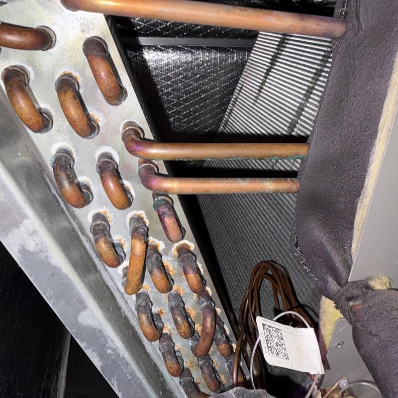 Air conditioner evaporator coil with copper tubing corrosion