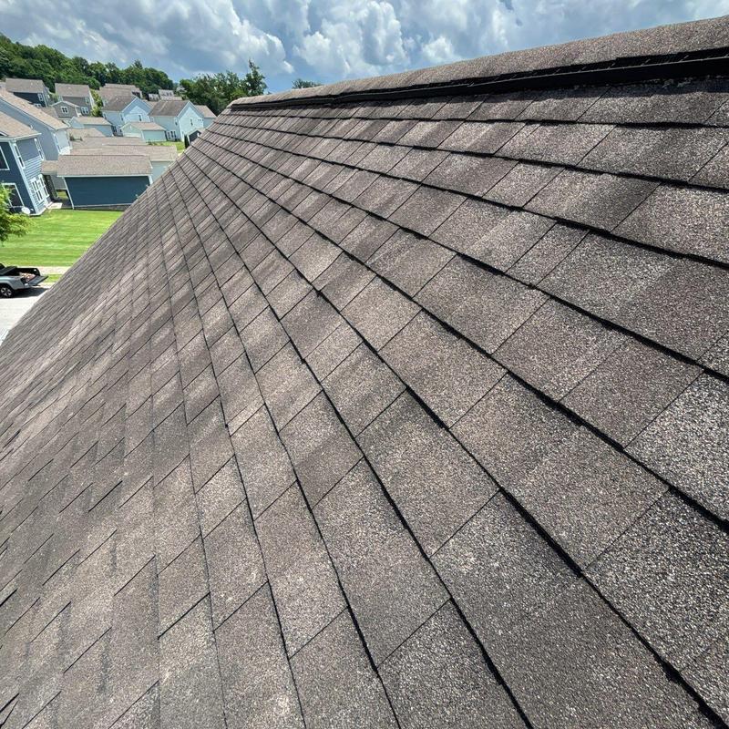 Asphalt shingle roof with hail damage inspection