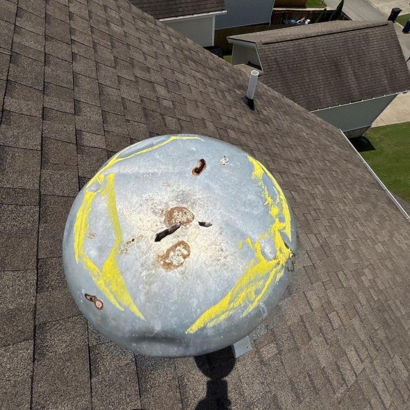 Roof vent cap with rust and damage marks