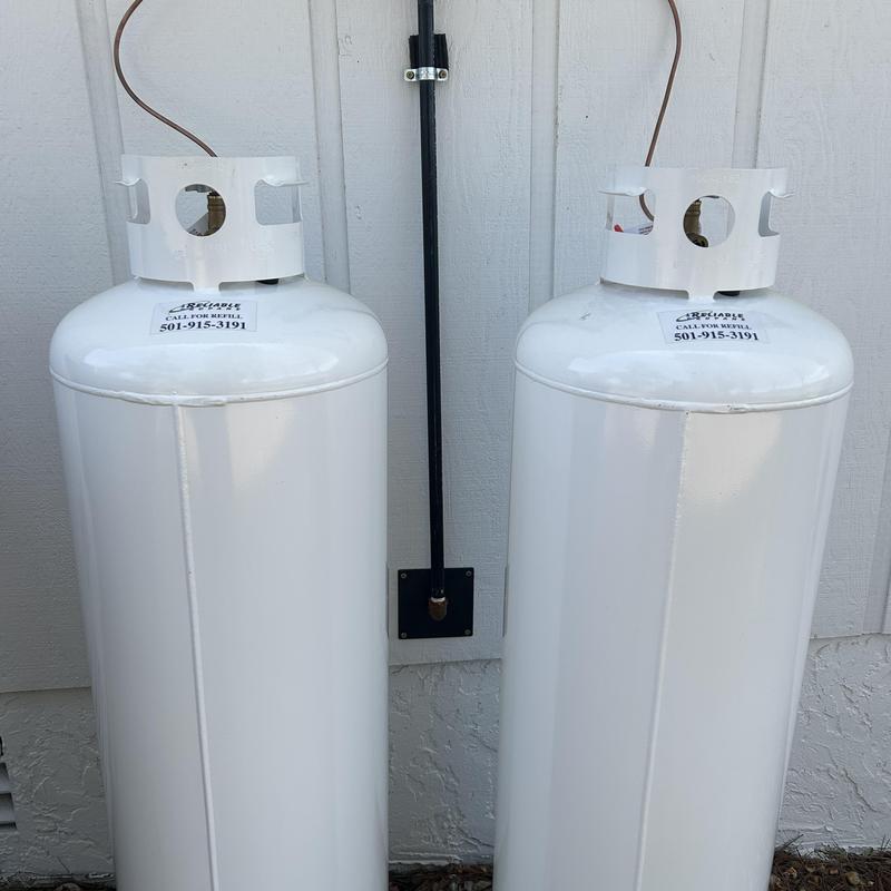 Propane tanks installed outside residential building
