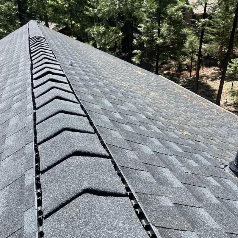 Asphalt shingle roof with ridge vent installation