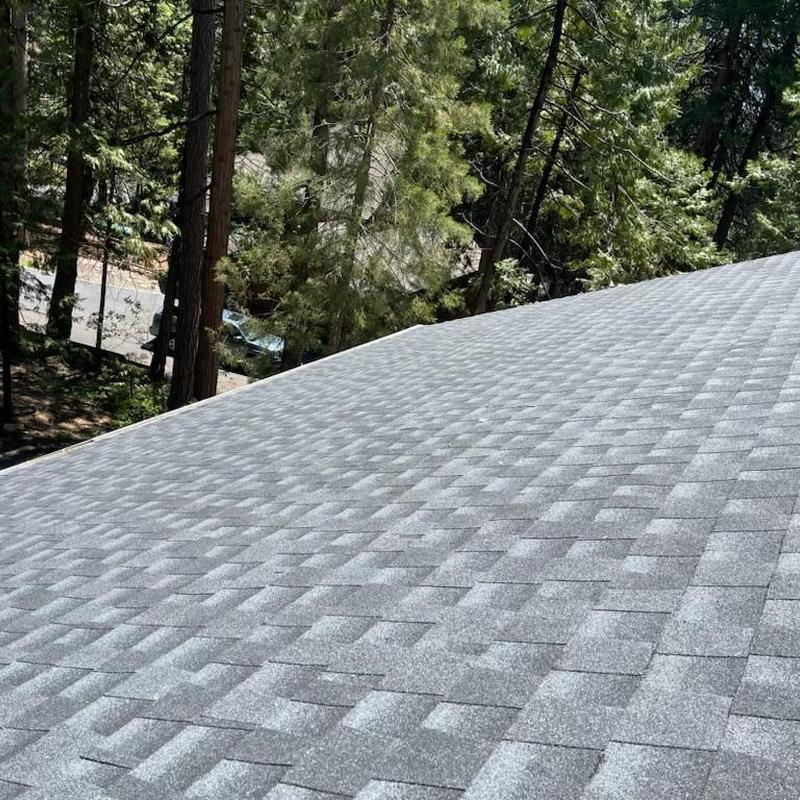 Storm-damaged shingle roof in Arnold California