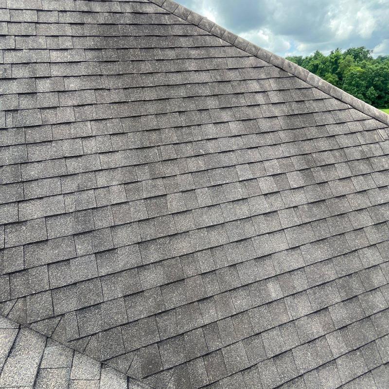 Asphalt shingle roof with hail damage and flashing issues