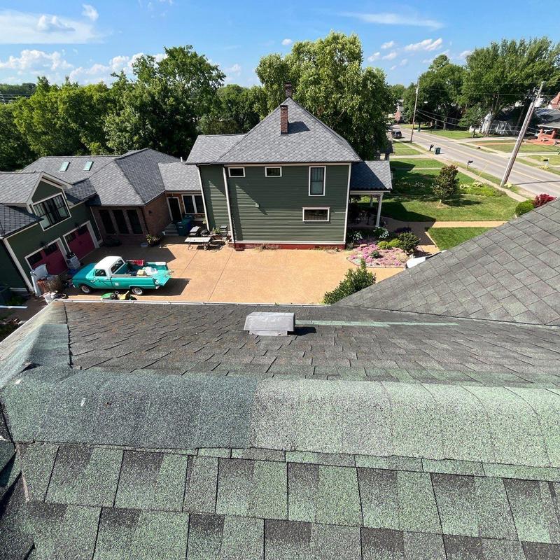 Hail damaged asphalt roof shingles with wear