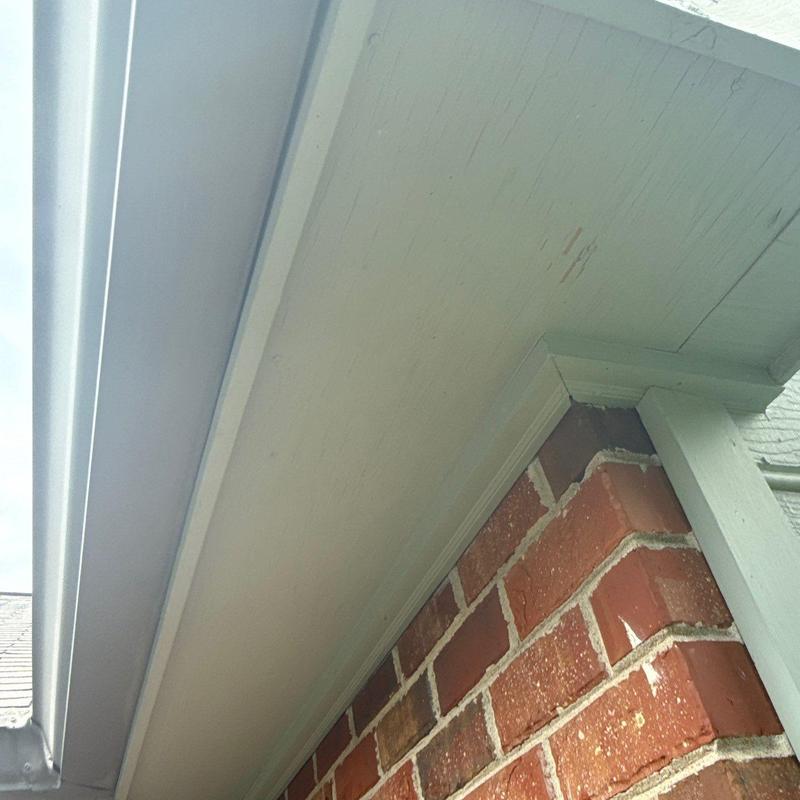 Eavestrough and soffit above brick exterior wall