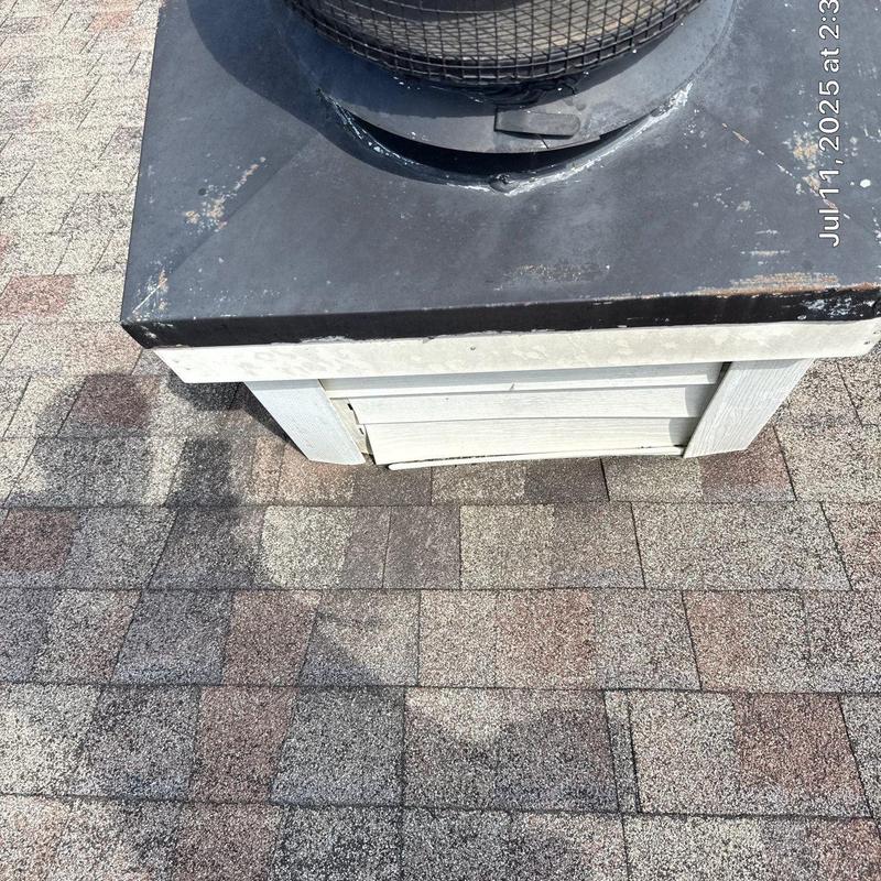 Roof flashing and shingle wear around chimney base
