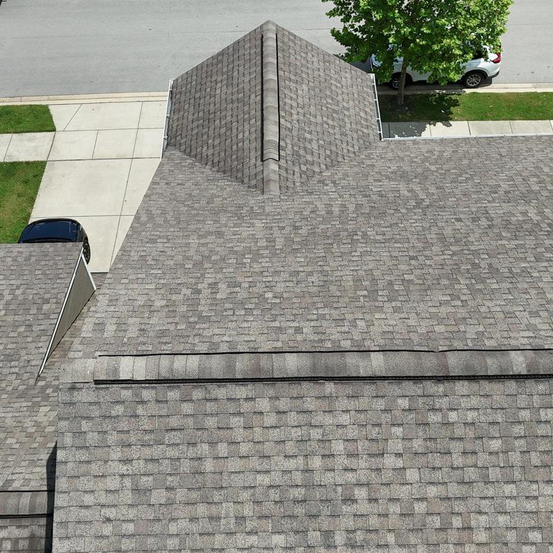 Asphalt shingle roof with hail damage and granule loss