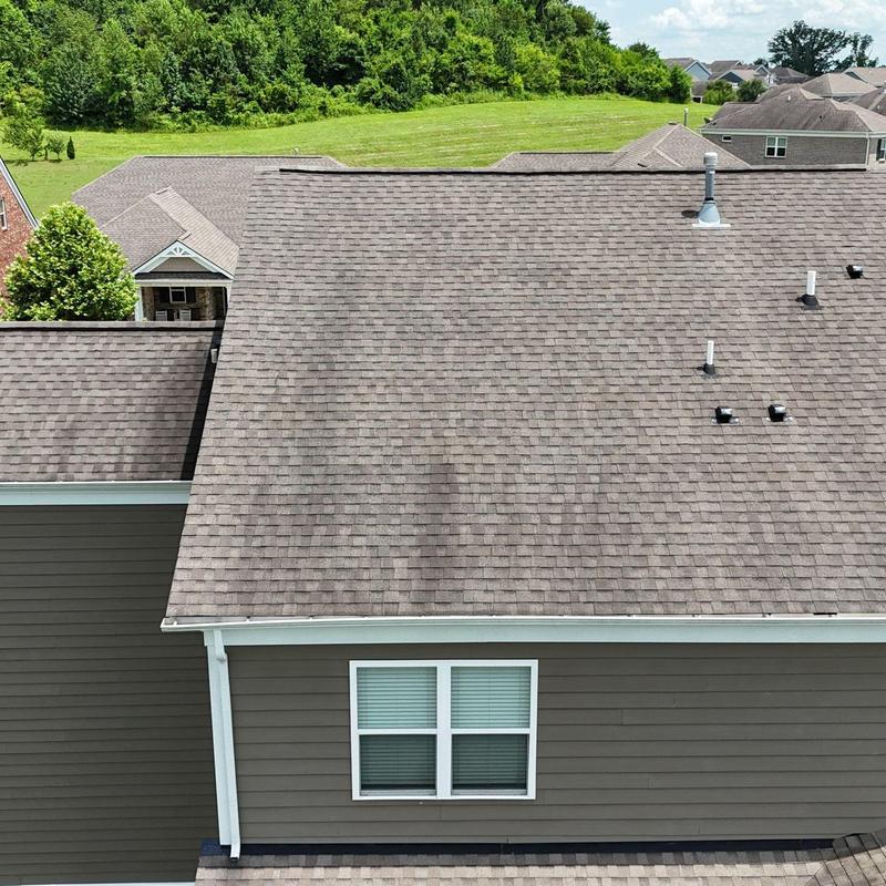 Asphalt shingle roof with hail damage and granule loss