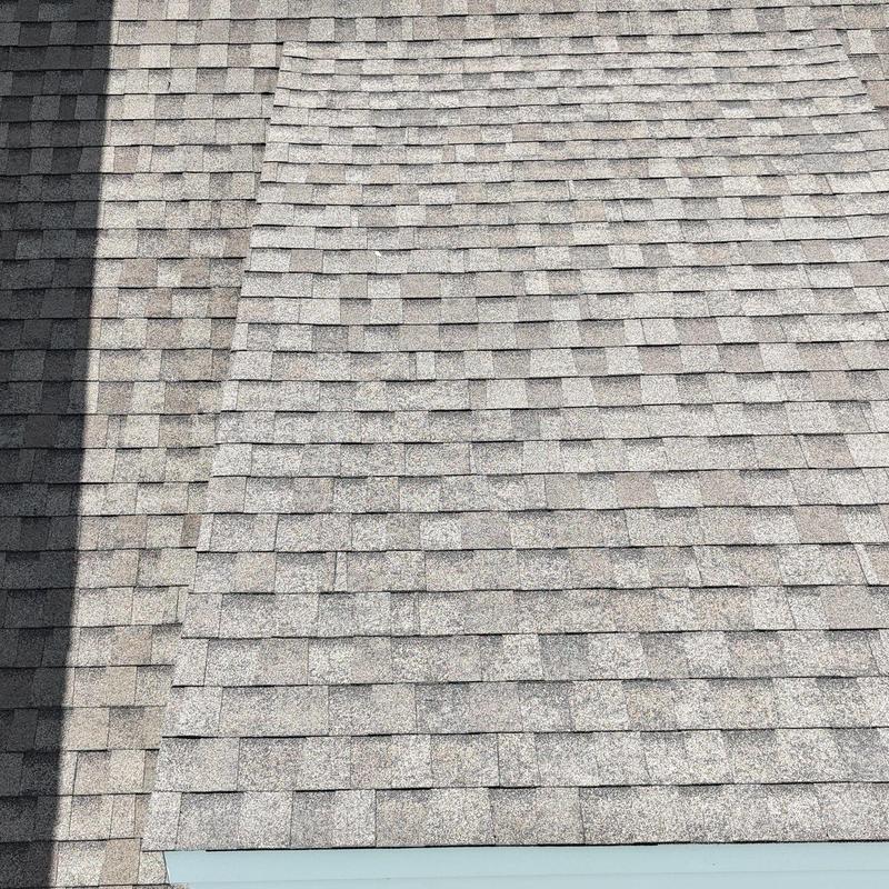 Asphalt shingle roof with hail damage and granule loss