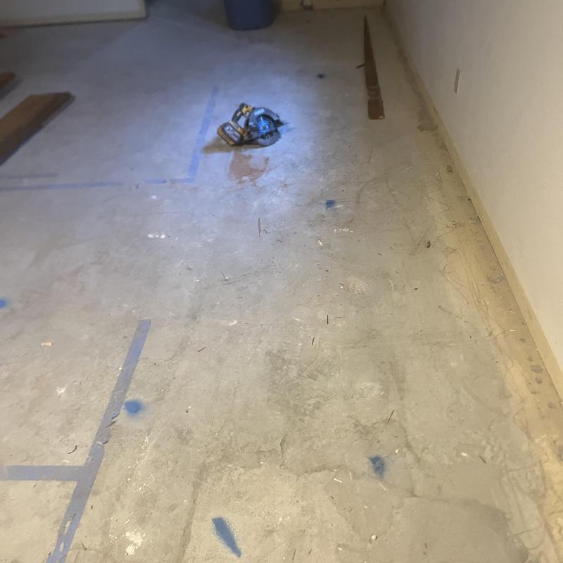 Sewer line locate markings on basement slab floor