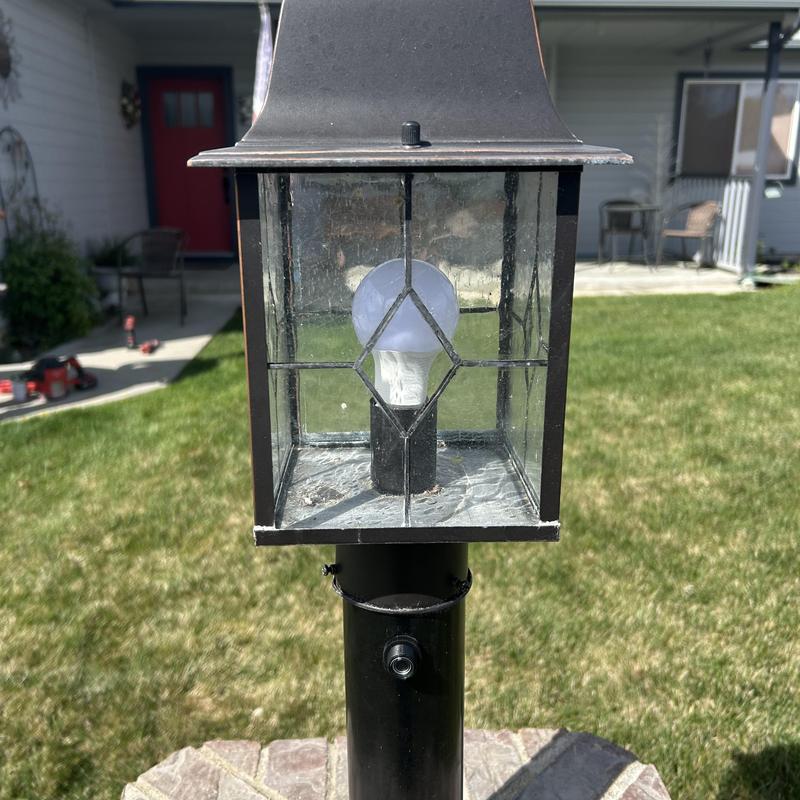 Yard light photocell sensor on black post lamp Yard light photocell sensor on black post lamp