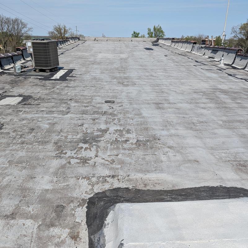 Flat commercial roof with elastomeric restoration prep