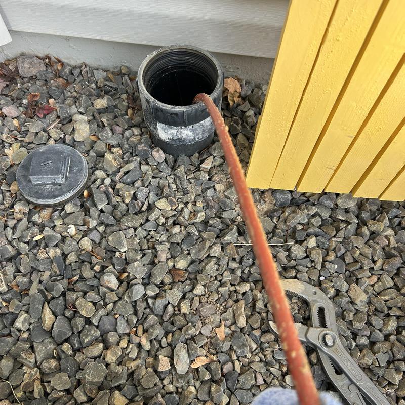 Sewer line inspection rod inserted in cleanout pipe Sewer line inspection rod inserted in cleanout pipe