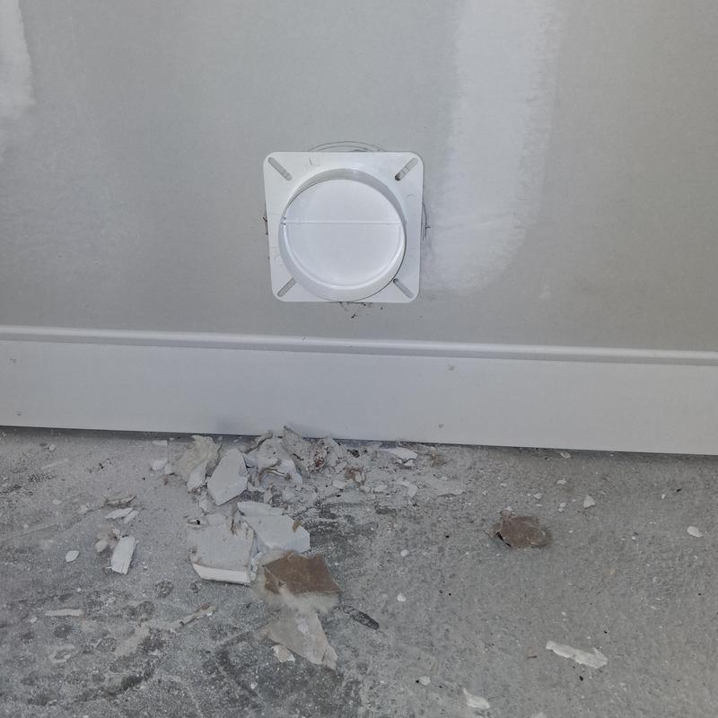 Dryer vent installation through brick wall with debris