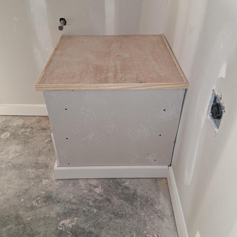 Gas hot water heater base framed and enclosed installation