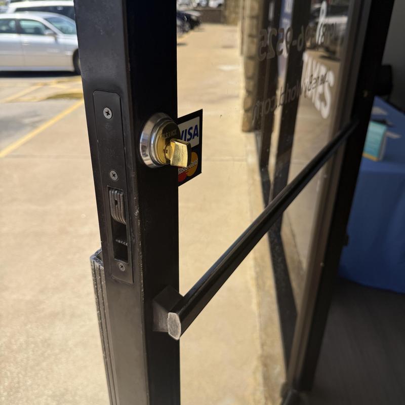 Inside thumb turn lock cylinder on storefront door