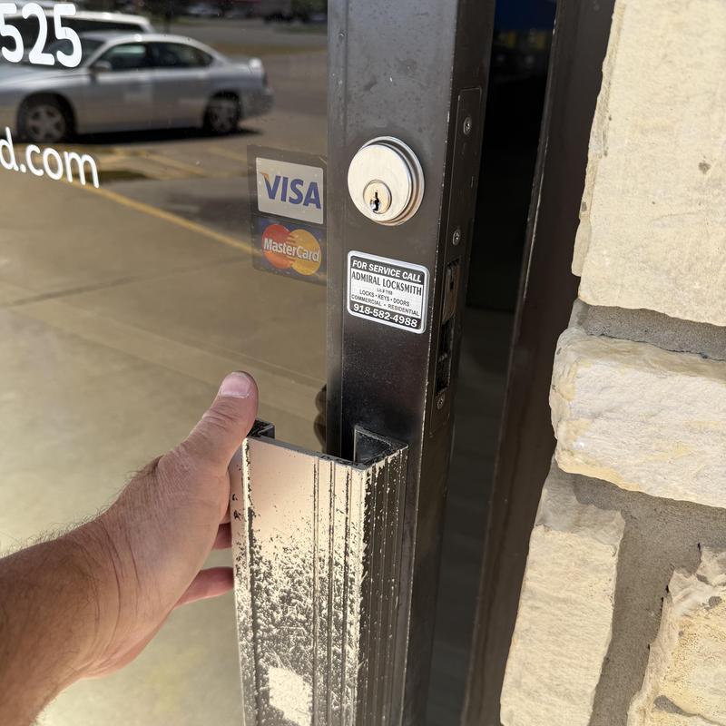 Thumb turn lock cylinder on storefront door