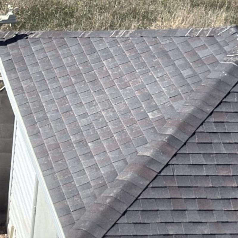 Asphalt shingle roof with ridge vent inspection